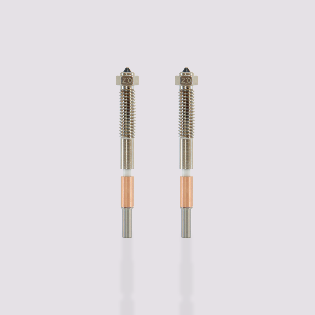 Two QIDI Max4 Bimetal Nozzles with 0.2 mm diameter tips, featuring silver, white, and copper components.