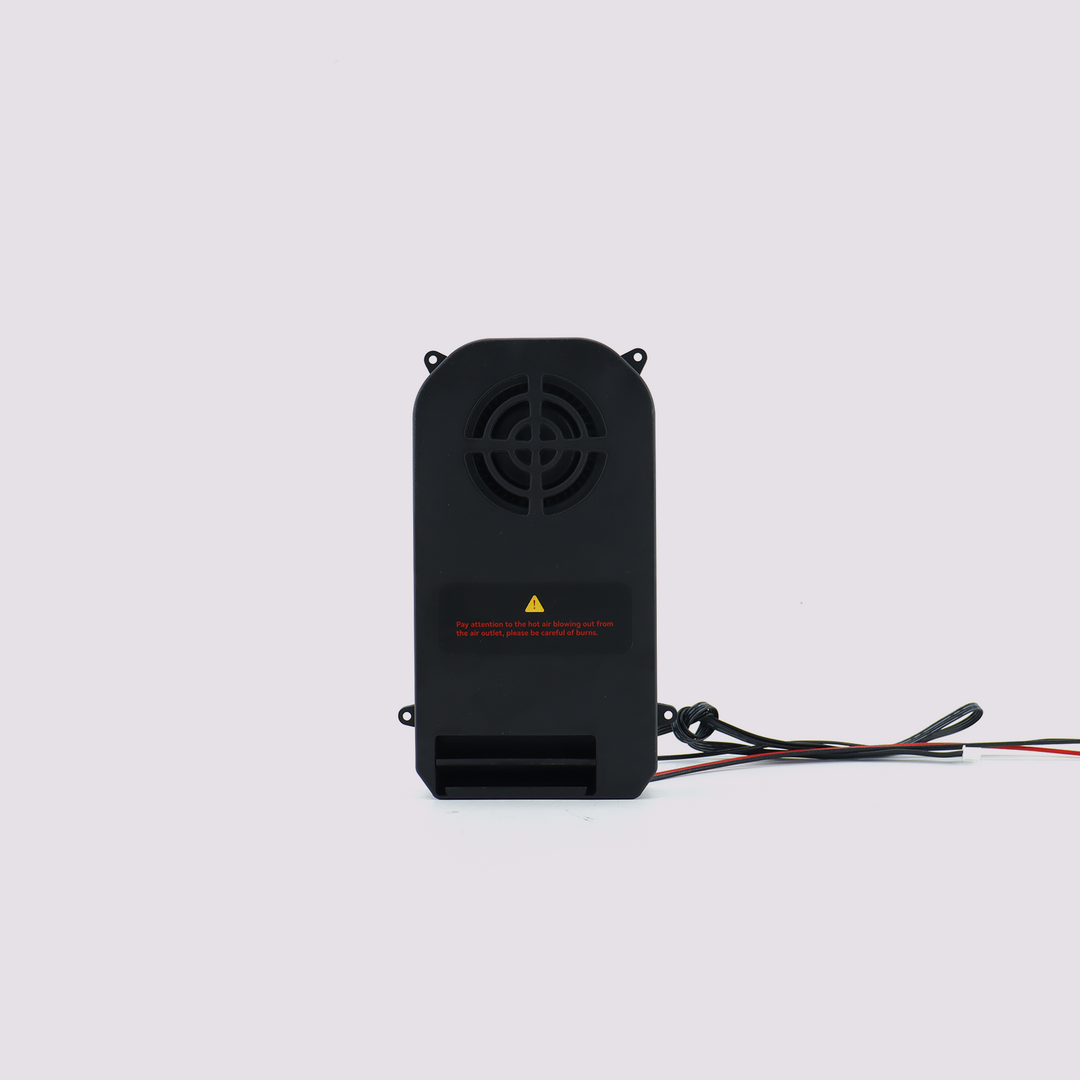 Black Q2 heater with fan component for a 3D printer, showing vent and warning label